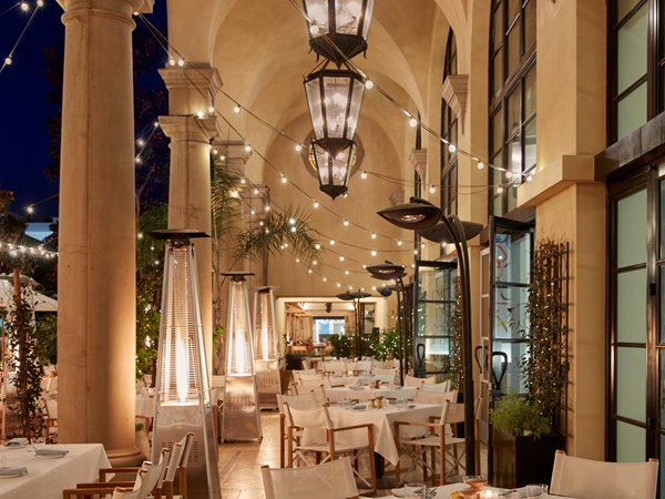 a restaurant outdoor terrace lit up with string lights