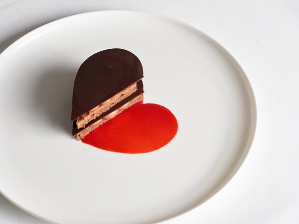 Brown and red heart shaped desert on a white background